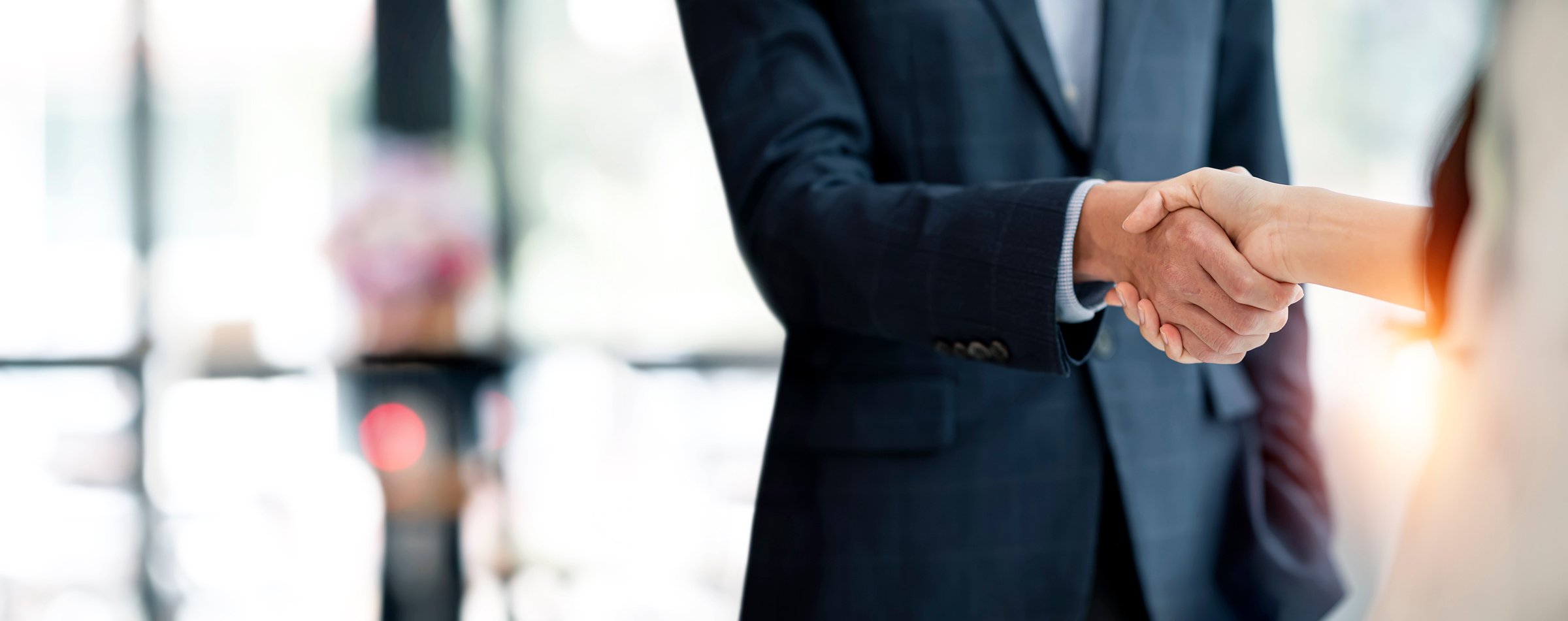 Business people shaking hands, finishing up meeting, busines